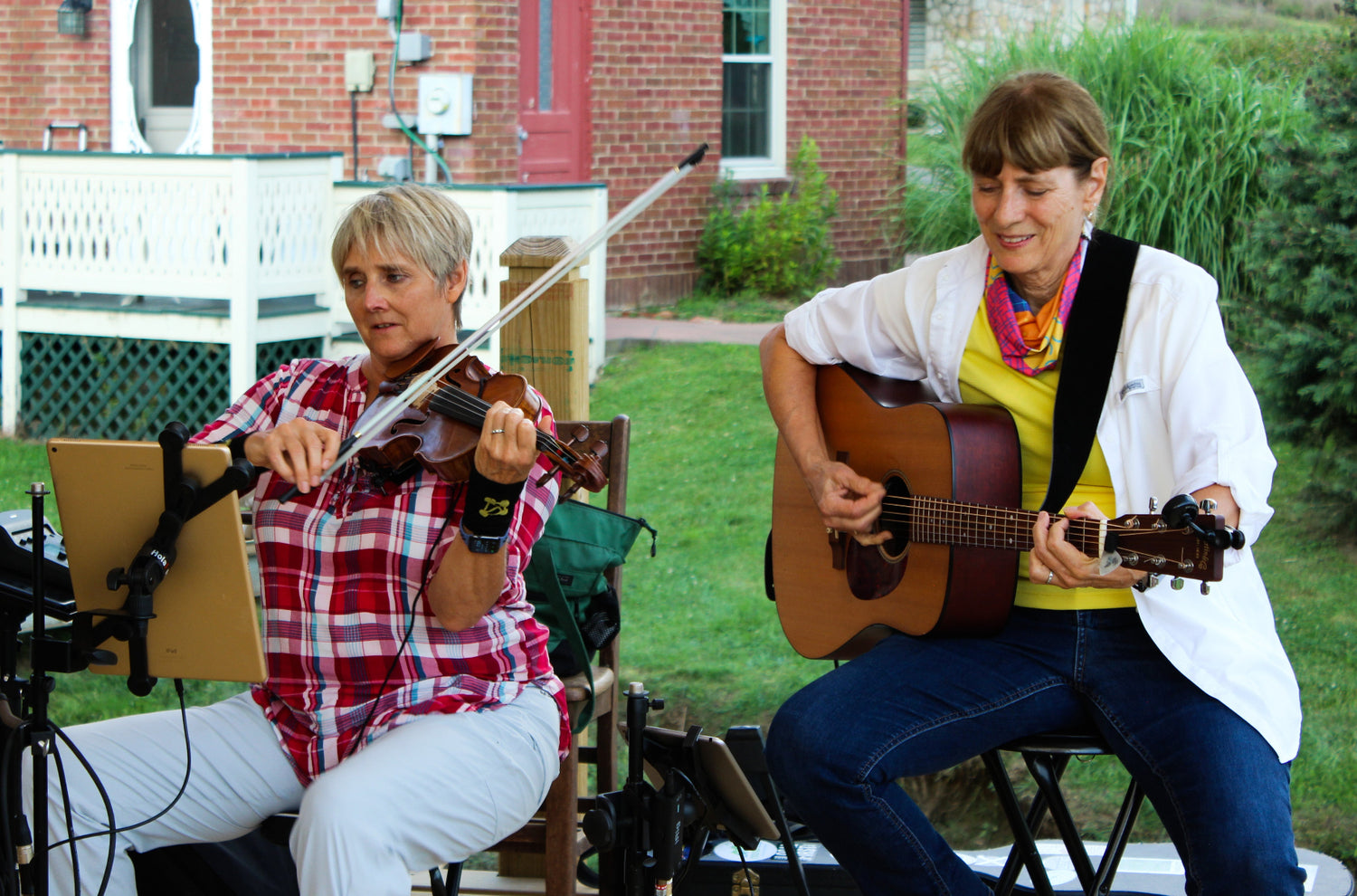 Musicians playing on the porch at The Old Store in Grassy Creek North Carolina